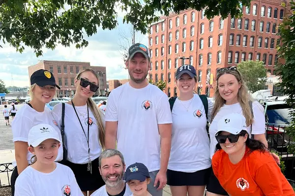 Team members and their families at Give Back Day 2024