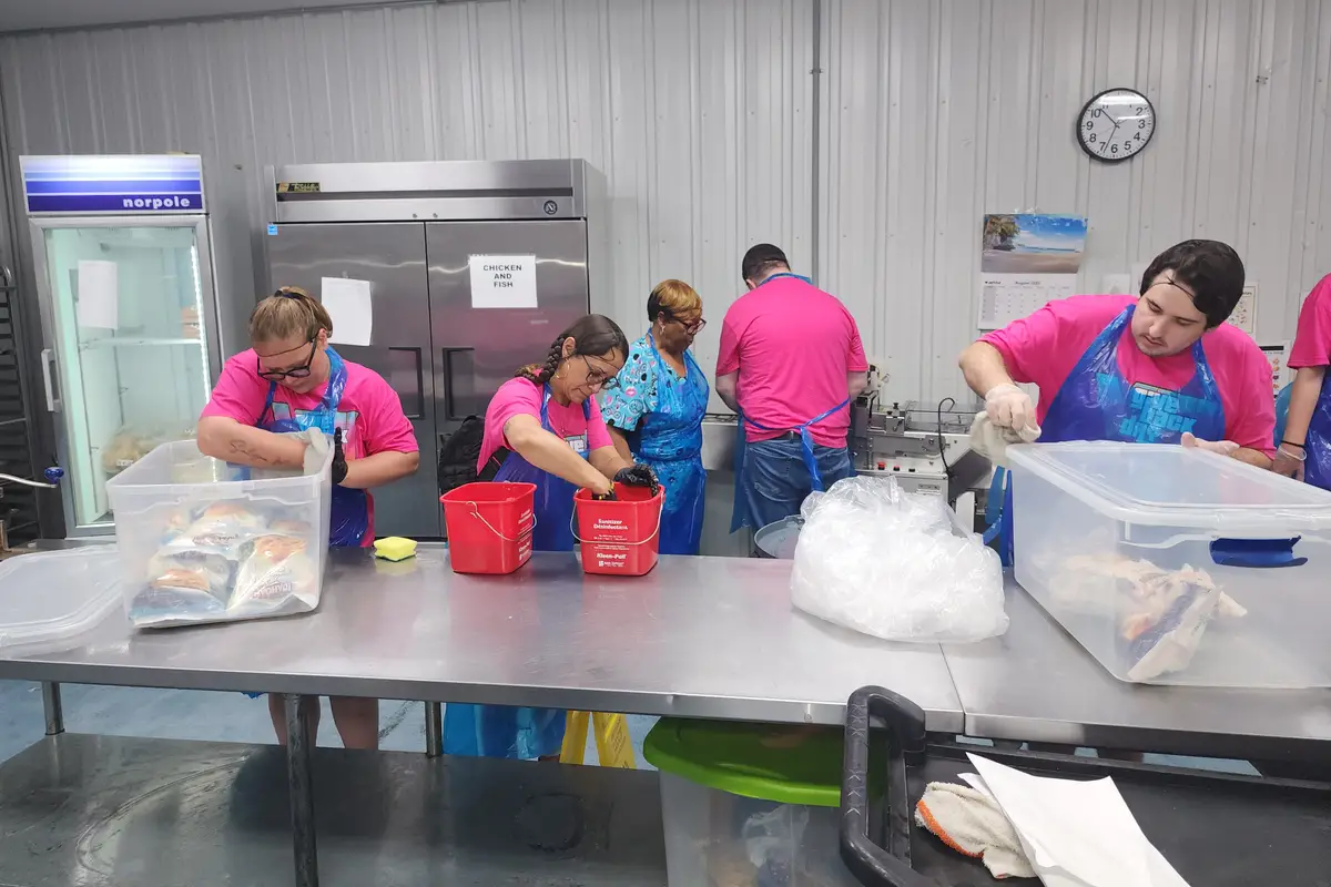 Volunteers preparing food in a nonprofit kitchen