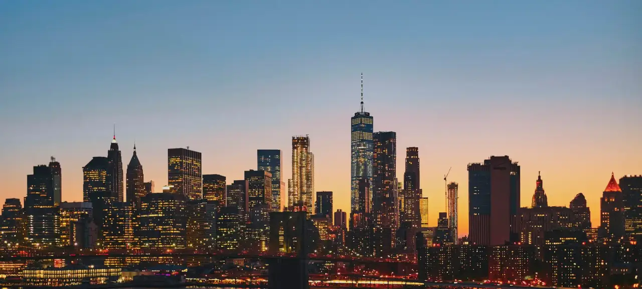 Lower Manhattan skyline and the East River at dusk