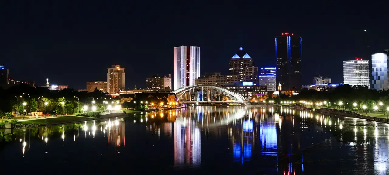 Downtown Rochester, New York, lit up at night along the river