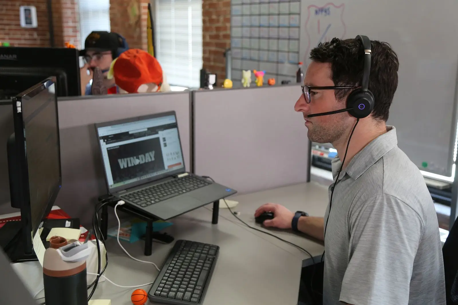 A team member at a desk