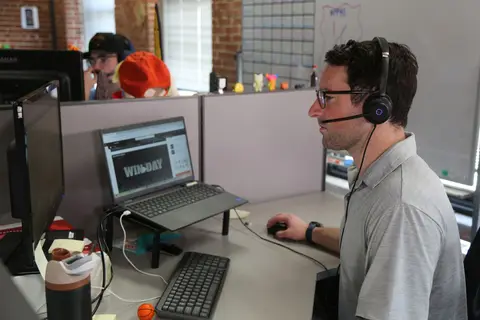 Abstrakt SDRs on calls in our sales center