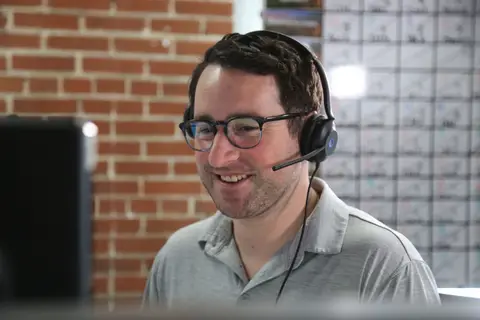 Abstrakt SDRs on calls in our sales center