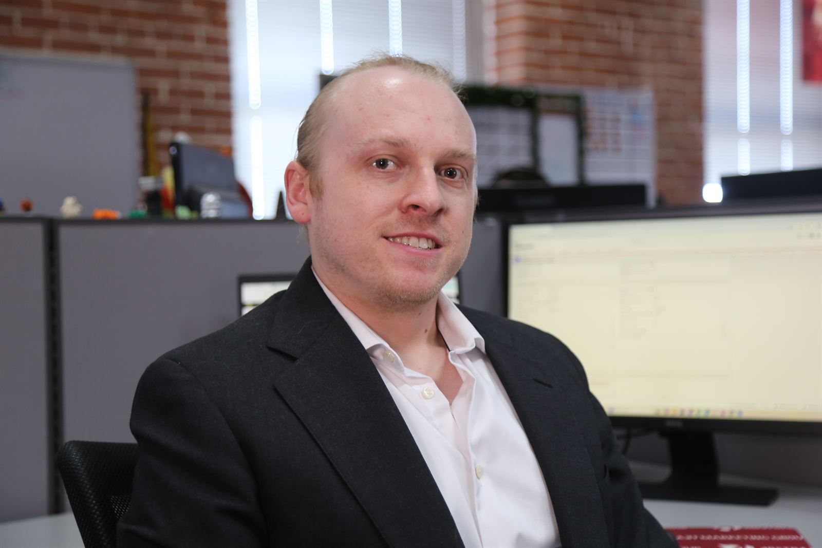 An Abstrakt sales specialist working commercial roofing accounts by phone